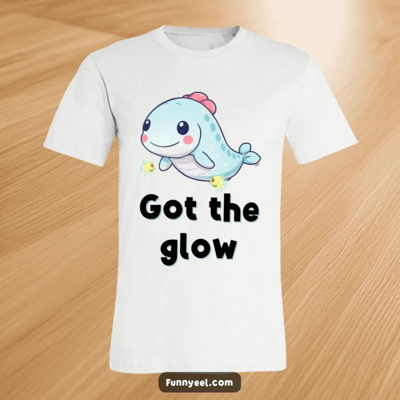 Funny Kawaii Eel T-Shirt: A determined kawaii eel energetically pursues a tiny, luminous plankton, depicted with dynamic, playful swirls.